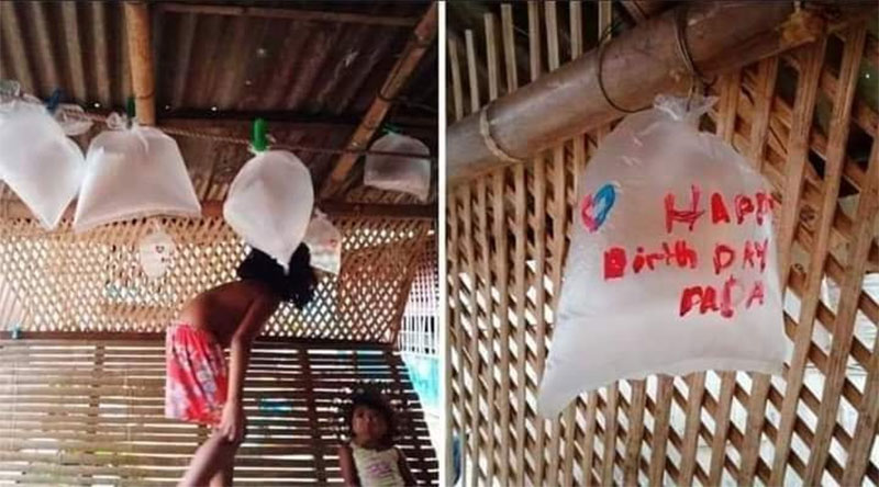 Niños utilizan bolsas plásticas como globos para celebrar el cumpleaños de su padre