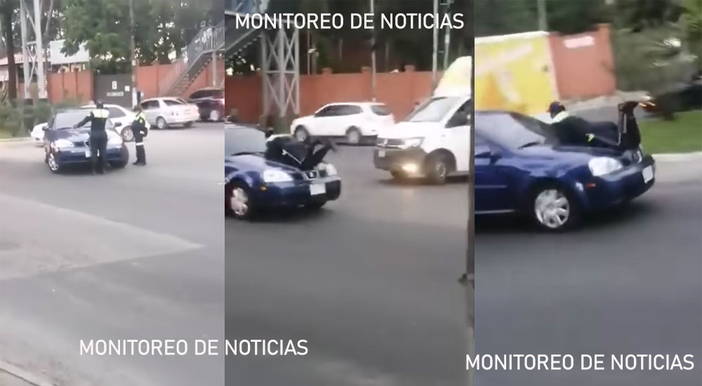 PMT trata de detener un vehículo pero no se detiene y el agente se sube encima del motor (Video)