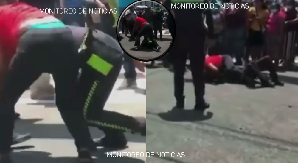 PMT Intentaba ponerle una multa a una mujer y terminan dándose a golpes (Vídeo)