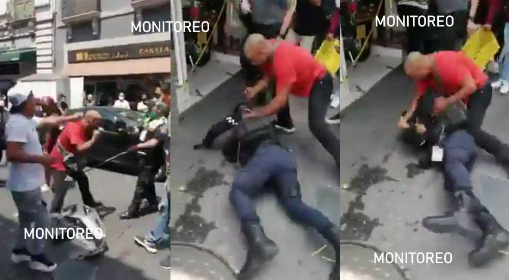 Hombre le da tremenda golpiza a policía que le querían poner cepo a su motocicleta (Video)