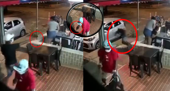 Ladrones entran para robar en un restaurante, Uno de los cliente cargaba arma y les disparó (Video)