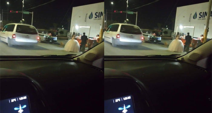 Captan a pareja de recién casados comiendo en un puesto de tacos