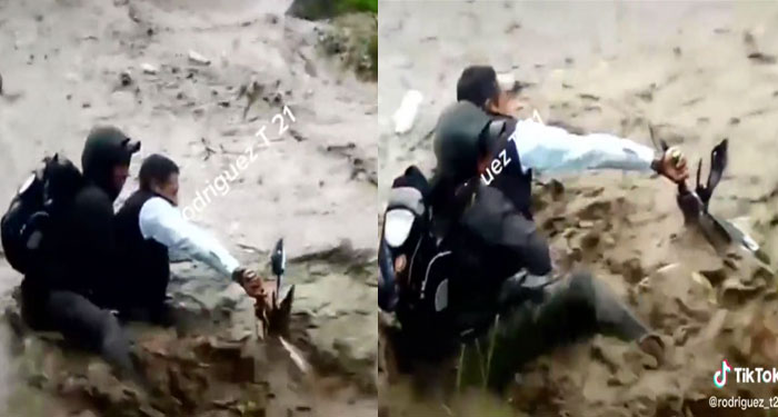 Dos hombres son arrastrados por la corriente de río junto a su motocicleta (Video)