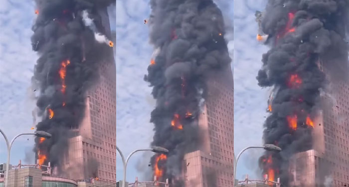 Momento de impresionante incendio en una torre de China de 218 metros de altura (Video)