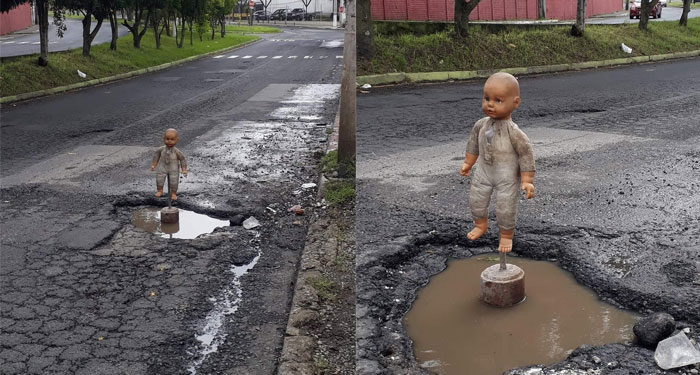 La terrorífica muñeca que alerta sobre un gran bache en el bulevar Tulam Tzu Mixco