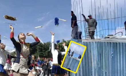 Momento en que albañil baila en medio de la obra al ver a las batonistas que desfilaban (Video)