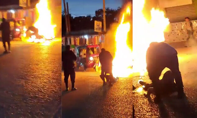 Momento en que Agente de la PNC rescata a un hombre cuando prendía fuego junto a su moto