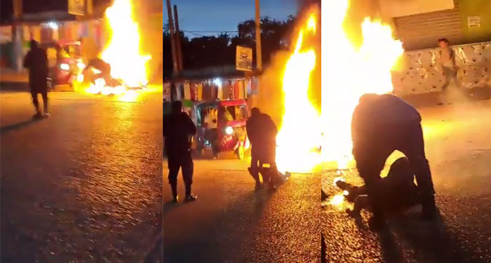 Momento en que Agente de la PNC rescata a un hombre cuando prendía fuego junto a su moto