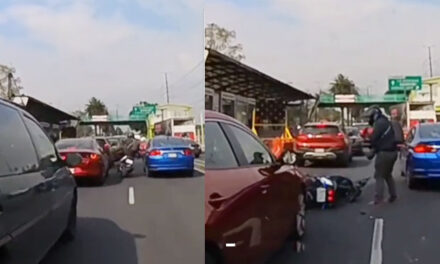 Momento en que un motorista quiso patear el espejo de un carro y le salió mal (Video)