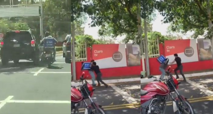 Momento en que conductor de vehículo y motorista se van a los golpes por no ceder la vía (Video)